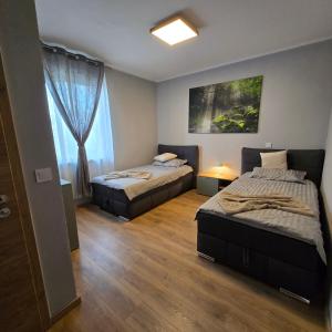 Ένα ή περισσότερα κρεβάτια σε δωμάτιο στο Boardinghouse Naim