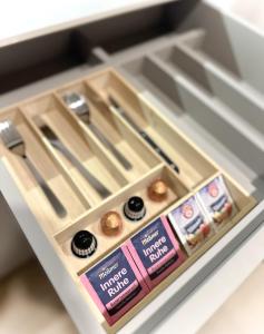 a drawer in a refrigerator with some donuts at Aparthotel Lavilo Main Square in Graz
