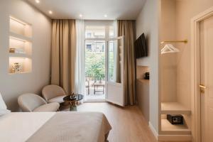 TV a/nebo společenská místnost v ubytování Agia Sofia 21 Suites - Smooth Living