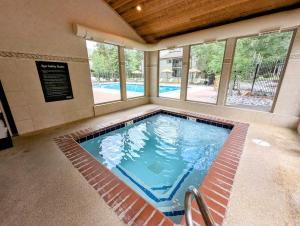 a large swimming pool in a building at Flying Dutchman 1155 by SummitCove Lodging in Keystone
