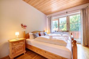Postel nebo postele na pokoji v ubytování Alpenkräuter