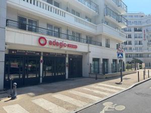 a building with an adota sign on the front of it at ALTAMIRA (Paris Expo - Porte de Versailles) in Issy-les-Moulineaux
