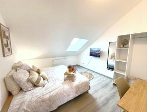 Ένα ή περισσότερα κρεβάτια σε δωμάτιο στο Maison Charmante - Pro & Famille - Tout Confort - 5 Chambres