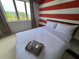 Postel nebo postele na pokoji v ubytování Thara Beach Resort