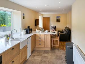 a kitchen with a sink and a counter at River View Sanctuary - Uk47338 in Pateley Bridge
