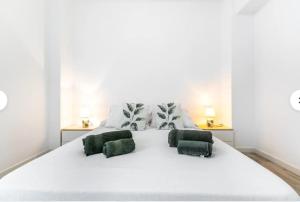 A bed or beds in a room at "Mi Casina" Apartamento Turistico en San Juan de Alicante