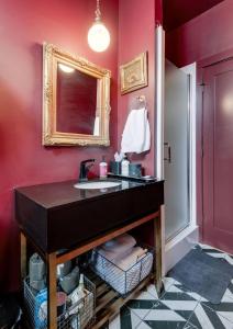 a bathroom with a sink and a mirror at Chic 2 Bed 2 Bath, In 12 South in Nashville