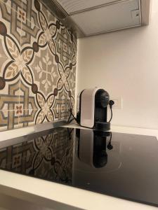 a black and white printer on a counter in a bathroom at Civico 13 in Bisceglie +16 photos
