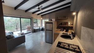 a kitchen with a stove and a counter top at Bush Serenity Studio in Marloth Park