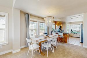 a kitchen and dining room with a table and chairs at Alluvial Shores in Rockaway Beach