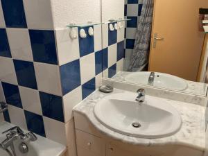 a bathroom with a sink and a mirror at Appartement T3 - 3 étoiles - 6 pers - Au pied des pistes in Villarembert +15 photos