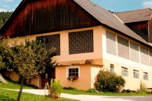 a large house with a red and white building at Graglerhof in Liebenfels