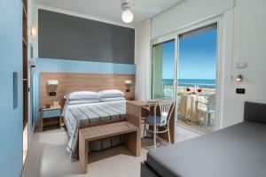 Postel nebo postele na pokoji v ubytování Hotel Astoria