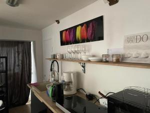 a kitchen with a counter with a coffee maker at Renthouse Rest & Go Paide in Paide