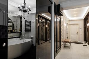 a bathroom with a bath tub and a sink at Urban Retreat Studio in Chişinău
