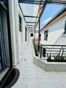 an empty hallway of a building with plants at The Luxe Urban Lounge in Kigali