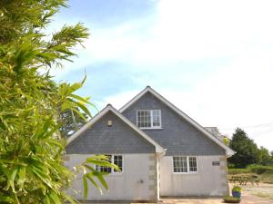 a white house with a gray roof at 5 Bed in Newquay 46489 in Truro