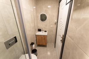 a small bathroom with a toilet and a sink at Casa Nova Hotel in Istanbul +74 photos