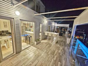 a large room with a table and a dining room at infinity sky deluxe in Ushuaia