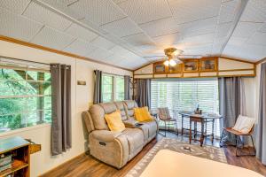a living room with a couch and a table at Hike, Swim, Ski and More Pet-Friendly Newland Home! in Newland