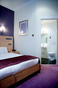 Кровать или кровати в номере Artto Hotel