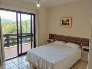 Ein Bett oder Betten in einem Zimmer der Unterkunft Morro do Sol Hotel & Eventos