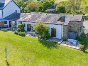 an aerial view of a house with a yard at 1 bed property in Gower 77981 in Penclawdd