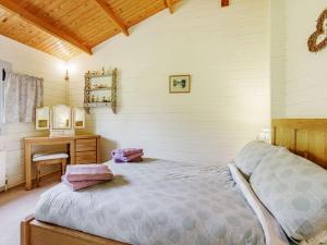 En eller flere senge i et værelse på 2 Bed in Clovelly BITFL