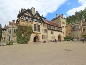 a large building with a ivy on the side of it at 2 bed in Rothbury 74812 in Rothbury