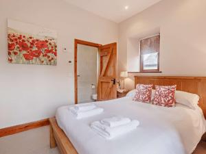 Ένα ή περισσότερα κρεβάτια σε δωμάτιο στο 4 Bed in Launceston BRHIG