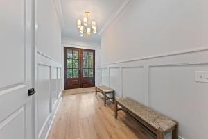 a hallway with a bench and a door at 3290 Coon Hollow in Seabrook Island
