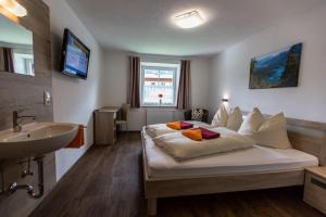 Postel nebo postele na pokoji v ubytování Haus Sandeck
