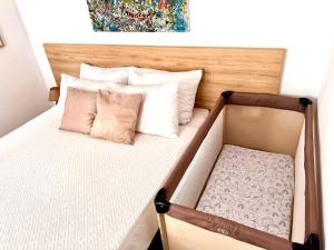 Postel nebo postele na pokoji v ubytování Golden Apartments