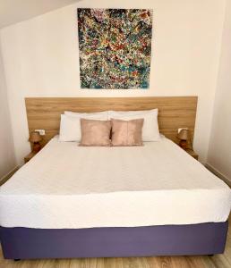 Postel nebo postele na pokoji v ubytování Golden Apartments