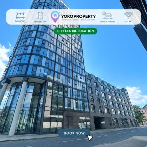 a tall glass building with a sign on it at iQuarter Apartment - City Centre - Free Secure Parking, Self-Check-In, Fast Wifi and Smart TV by Yoko Property in Sheffield