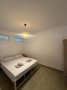 Postel nebo postele na pokoji v ubytování Parea Apartment