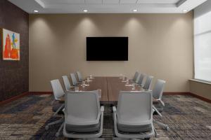 a conference room with a long table and chairs at Residence Inn by Marriott Lincoln Downtown in Lincoln