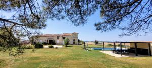a house with a yard with a swimming pool at La Colline Gersoise-Piscine-Sauna in La Sauvetat