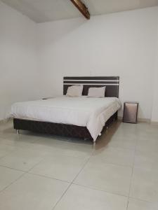Tempat tidur dalam kamar di Tranquilandia