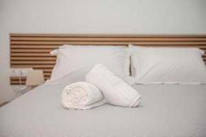 Giường trong phòng chung tại Massalia Suites