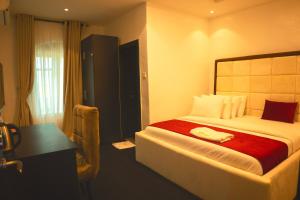 Ένα ή περισσότερα κρεβάτια σε δωμάτιο στο HomeWorth Hotel