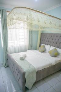 Postel nebo postele na pokoji v ubytování SpringStone executive apartment A18