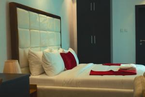 Ένα ή περισσότερα κρεβάτια σε δωμάτιο στο HomeWorth Hotel