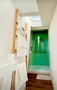 a bathroom with a shower and a sink at Contemporary-style pavilion in Narbonne