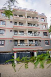 a tall building with balconies on the side of it at SpringStone executive apartment A 11 in Ongata Rongai 