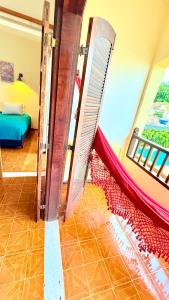 Postel nebo postele na pokoji v ubytování Pousada Jardins Paraty