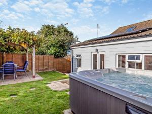a hot tub in the backyard of a house at 2 Bed in Cromer 29556 in Cromer