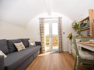 a living room with a couch and a table at 1 Bed in Teviothead 75346 in Hawick +22 photos