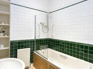 a bathroom with a shower and a tub and a sink at 2 Bed in Blairgowrie CA248 in Blairgowrie +18 photos