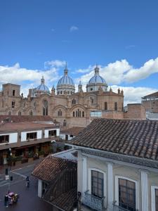 a large building with domes on top of it at Casa Vega in Cuenca